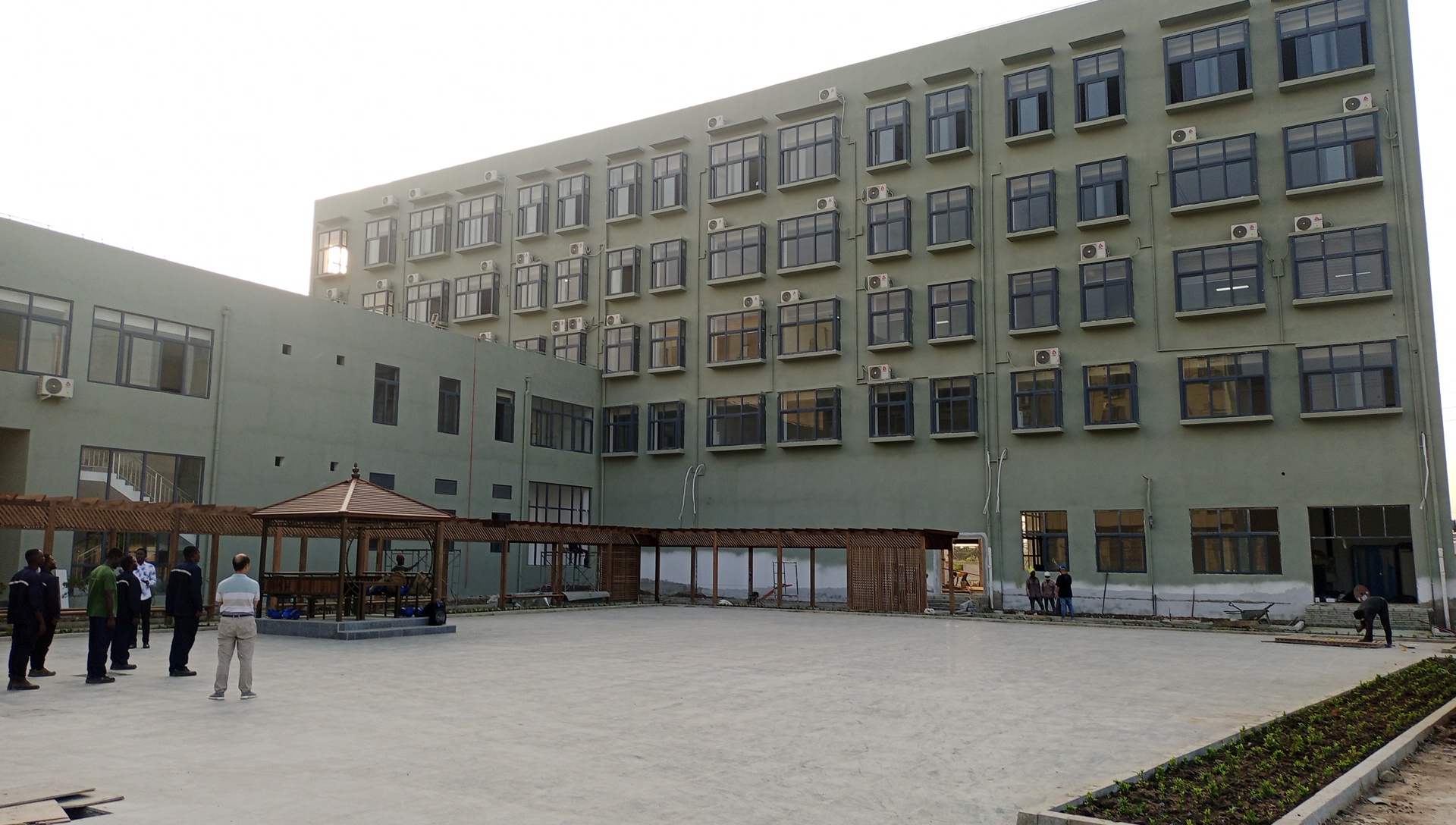 Alucobond Ghana workers on a modern commercial building construction site in Ghana